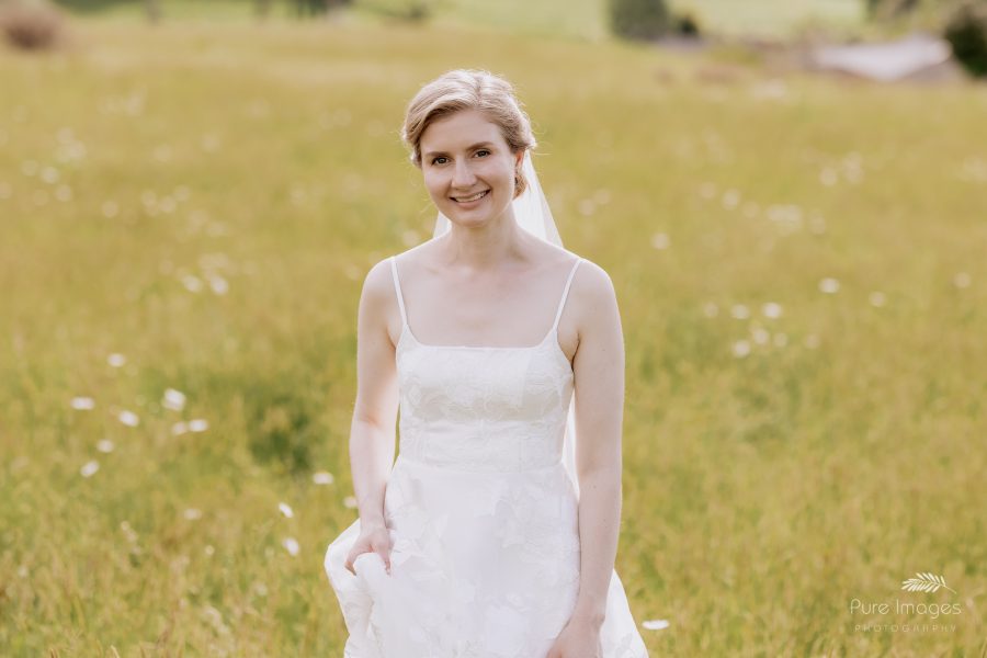 happy bride in daisy field