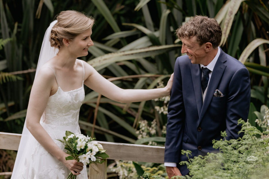 wedding couple greet at end of aisle at backyard wedding