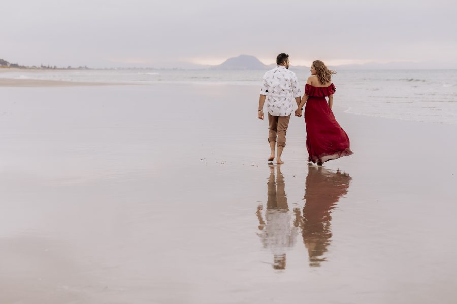 couple on beach photo shoot with Pure Images Photography