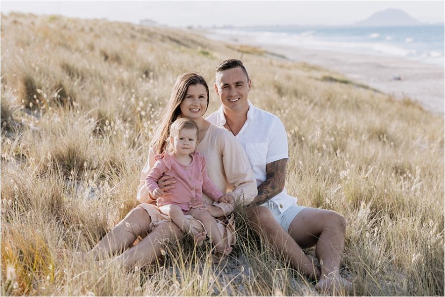 Young family photo in sandunes