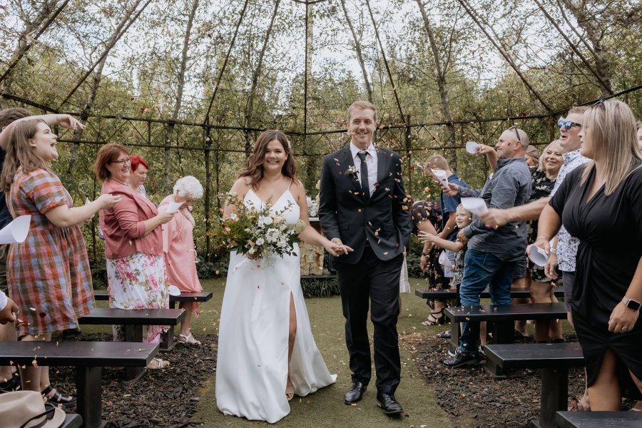 Just married couple walking down aisle