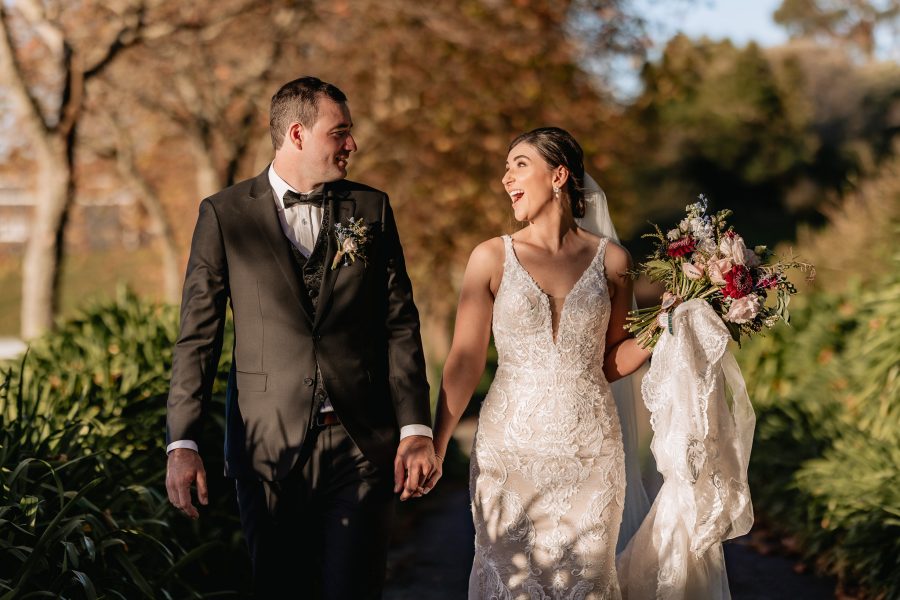 Happy surprised bride at Eagle Ridge walking in sunshine