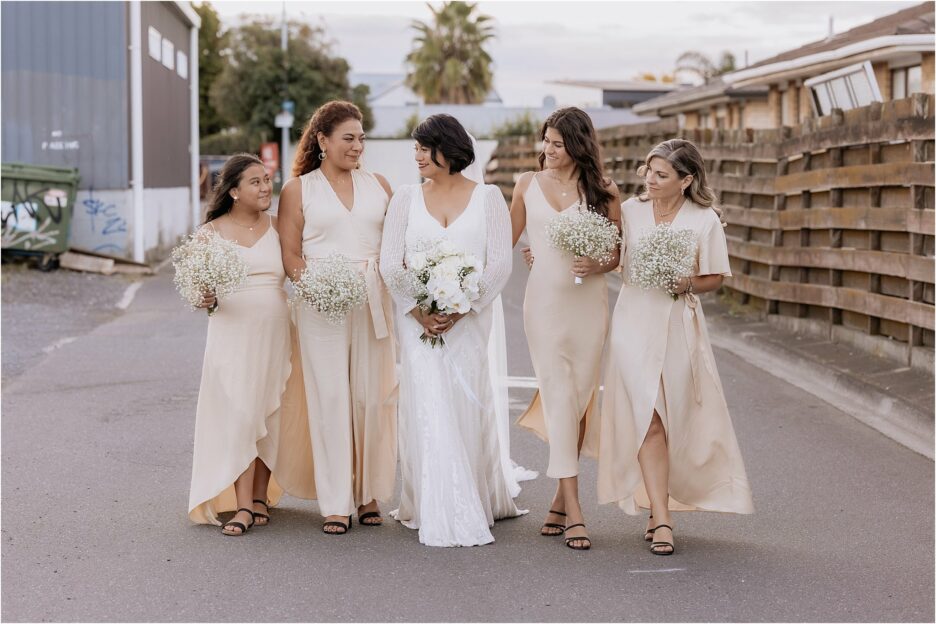 Blak bridesmaids blush bridesmaids walking Fife lane