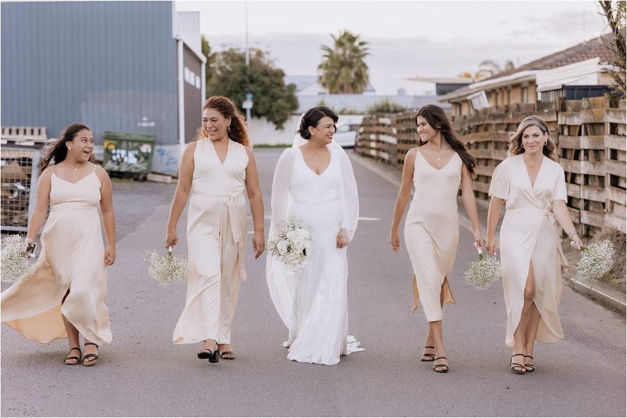 the girls back alley on fife lane in blak bridesmaids dresses in blush pink with Bride in Karen Willis Holmes wedding Dress