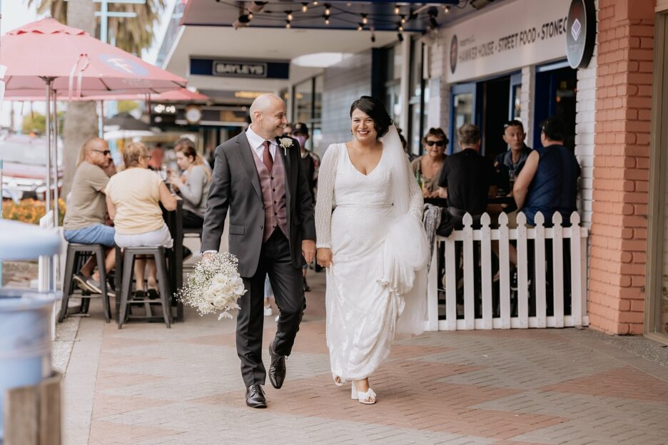 walking along Mount Main street on wedding day