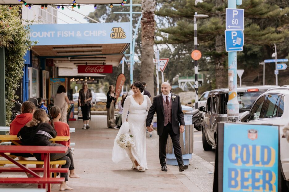 Couples wedding photos along main Mount shops