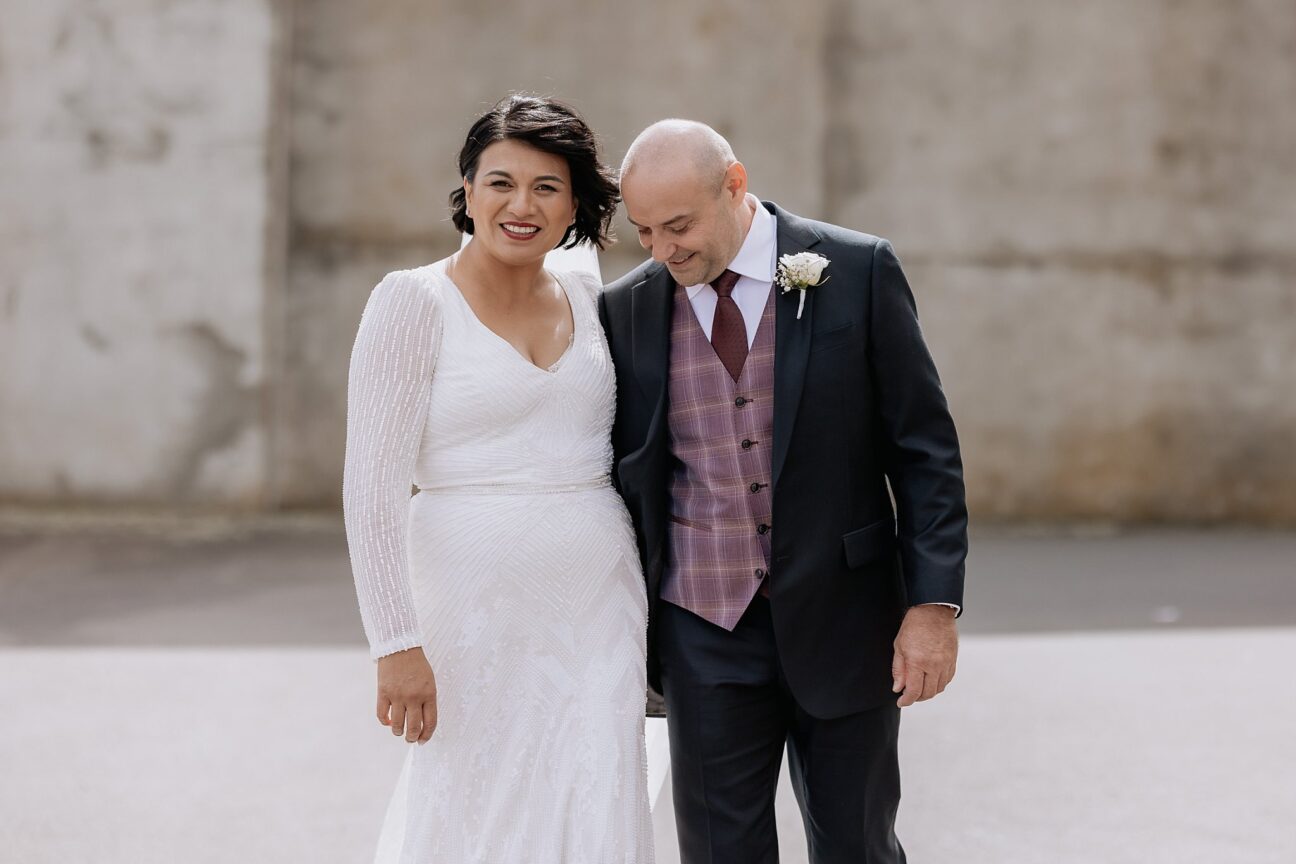 happy walking wedding couple