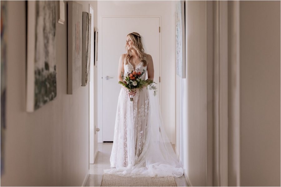 Bride in hallway in Madi Lane Wedding dress