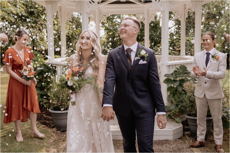 confetti thrown on bride and groom