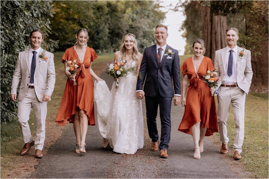 Country driveway with rust wedding party and linen