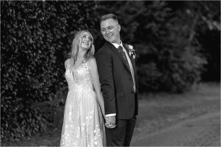 wedding couple turn to look at eachother