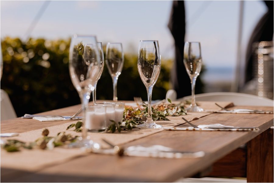 Table settings of wine glasses wooden tables