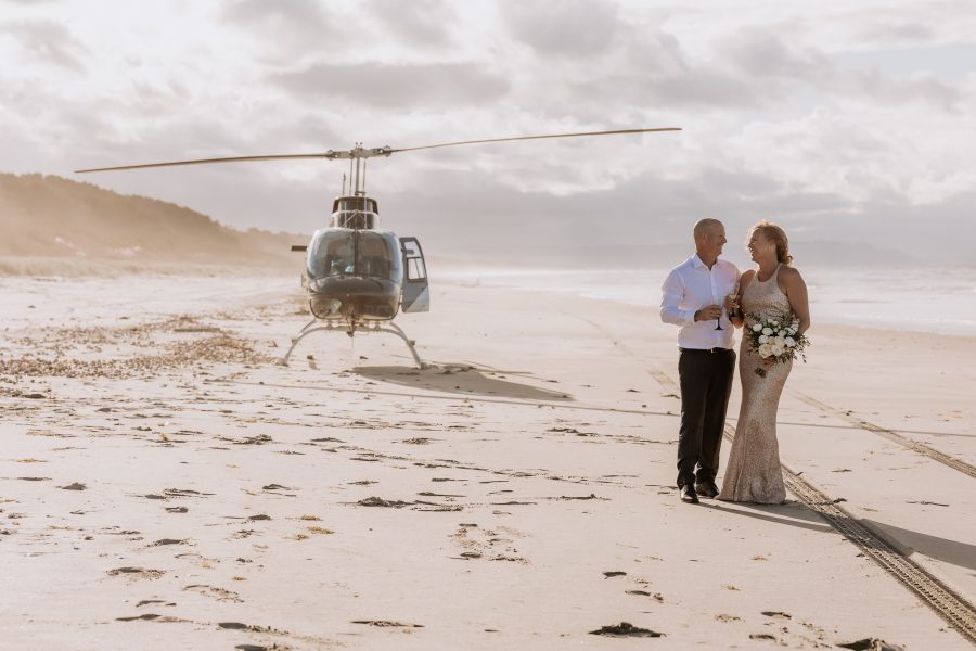 Matakana Island beach wedding photos with helicopter
