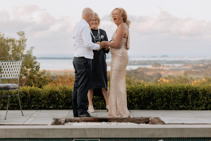 wedding ceremony at Omokoroa beside pool