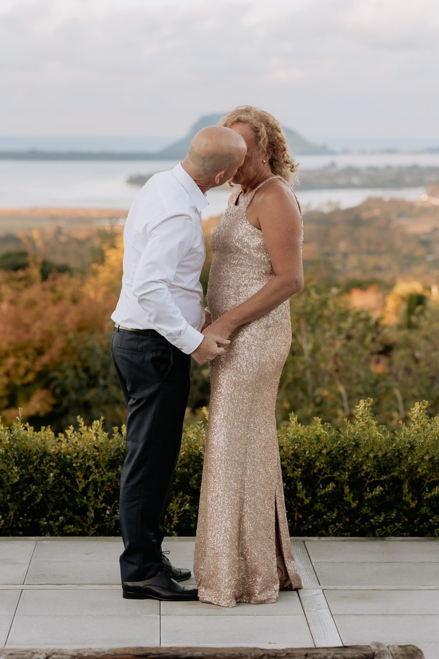 Whakamarama back yard wedding ceremony with Bay of Plenty behind