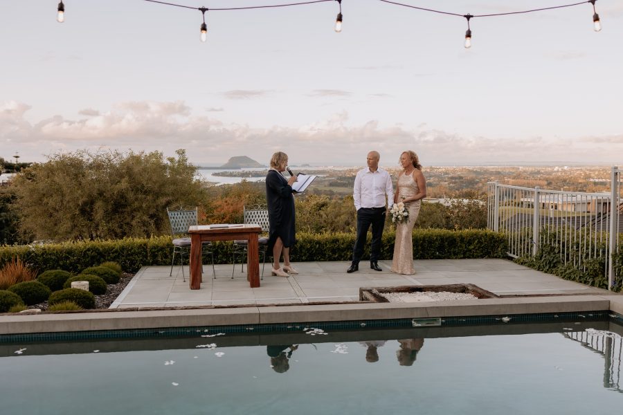 getting married with marriage celebrant by pool in Tauranga wedding