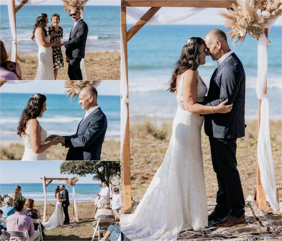 First kiss and rings going on at beach wedding