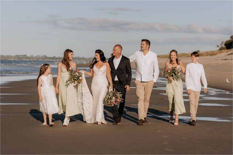 Wedding party photo with bridesmaids in pistachio green dresses