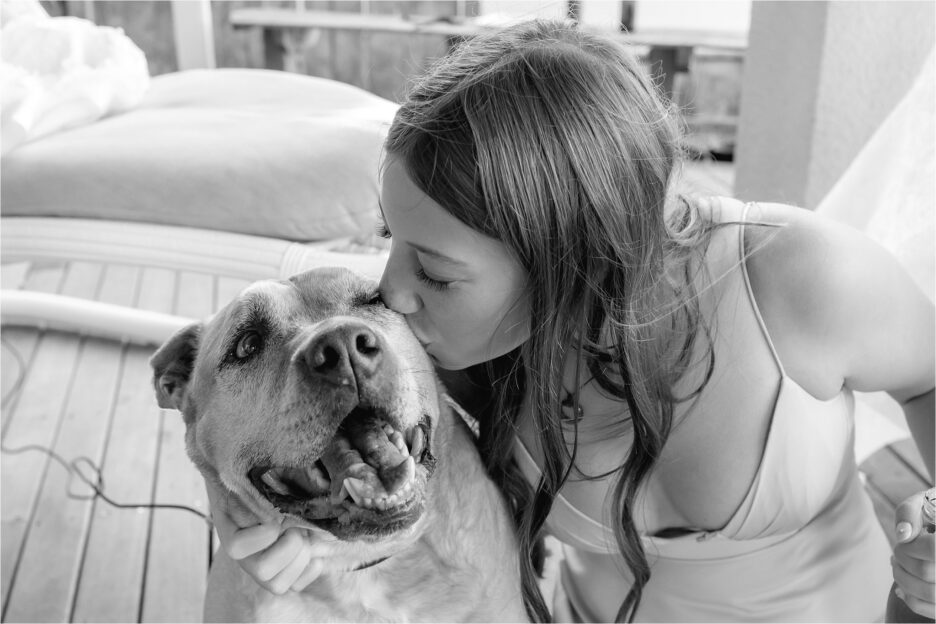 bridesmaid kisses dog