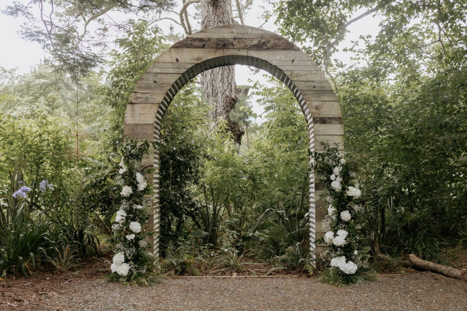 Old Forest School outdoor wedding ceremony area with garden arch