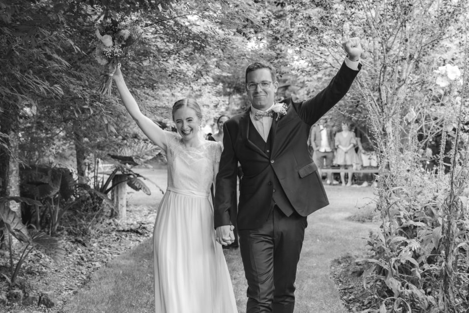 Bride and Groom celebrate walking down aisle at Old Forest School