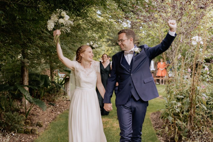 Fist pump wave just married couple