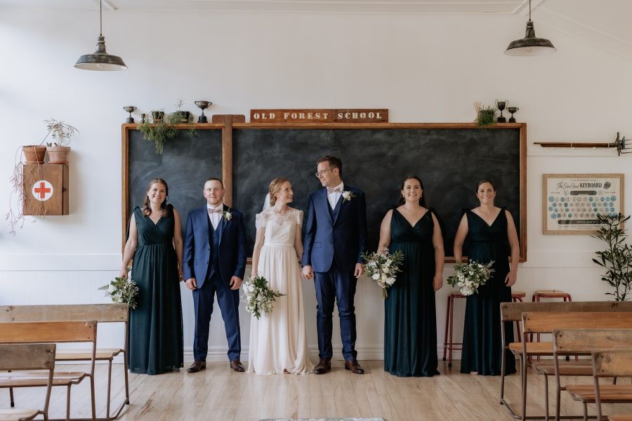 Wedding party inside school room at Old Forest School