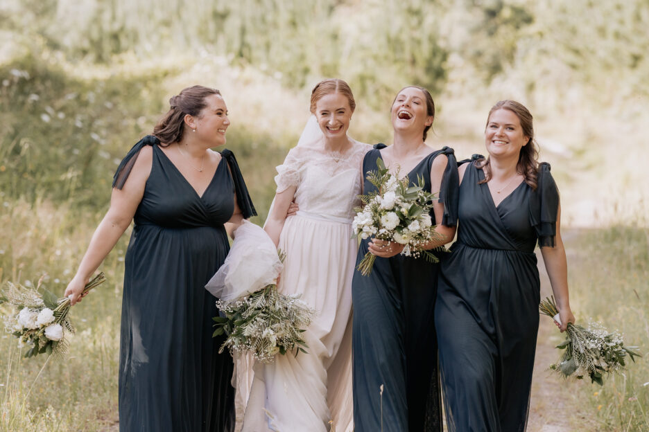 Brides squad having fun walking on forest lane at Old Forest School