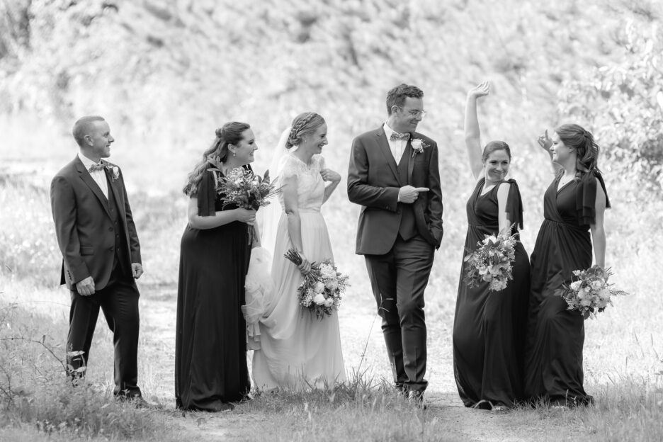 Laughing wedding party photos at Old Forest School