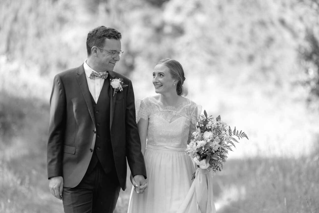 Bride happy walking with husband during photos old forest school pukehina