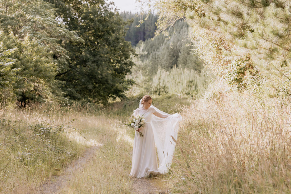 Bride picks up dress at Old Forest School country lane