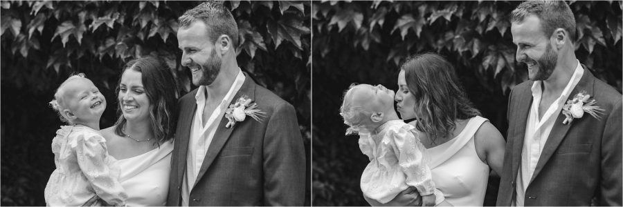 bride with flower girl giggling and kissing