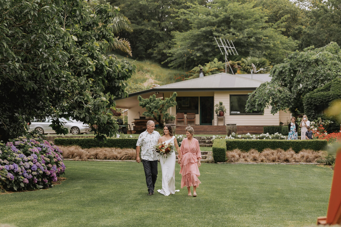 Mother and father of bride walking down aisle at The Run Whakatane