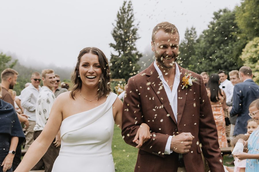 Bride and groom walking down aisle Matata country wedding venue