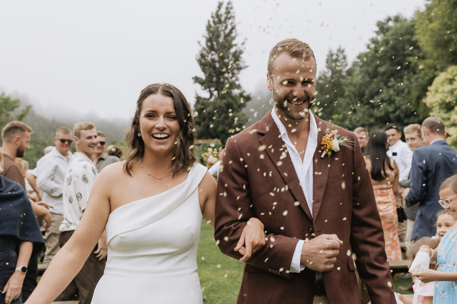 Bride and groom walking down aisle Matata country wedding venue