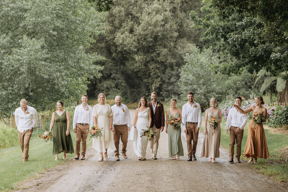 Whakatane wedding party walking on country road at Matata just outside of Whakatane