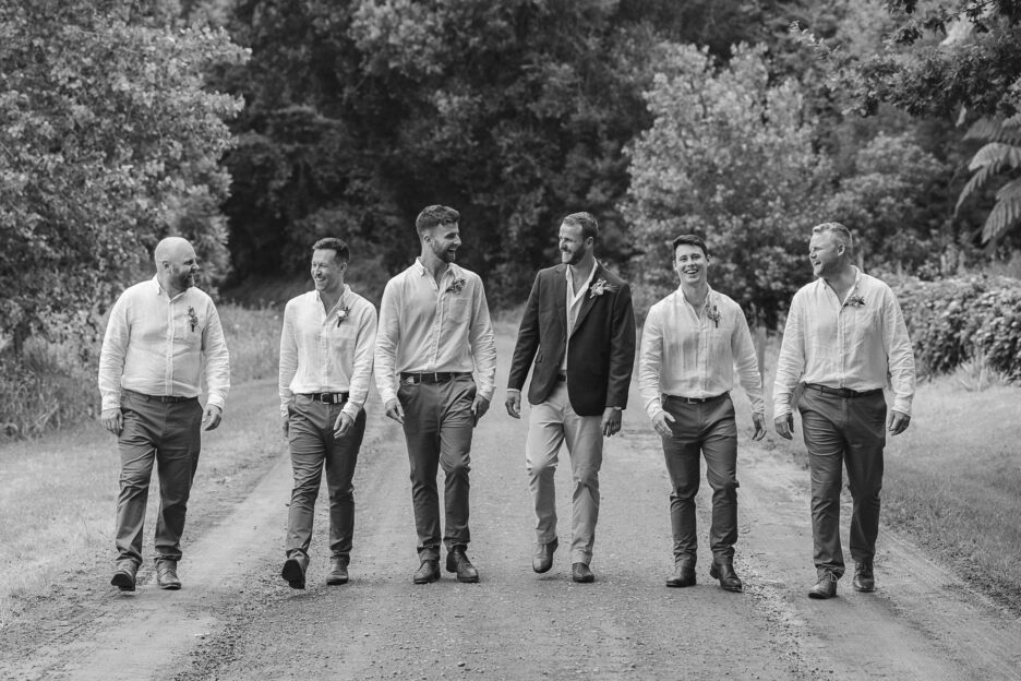 Groomsmen walking at The run Whakatane wedding