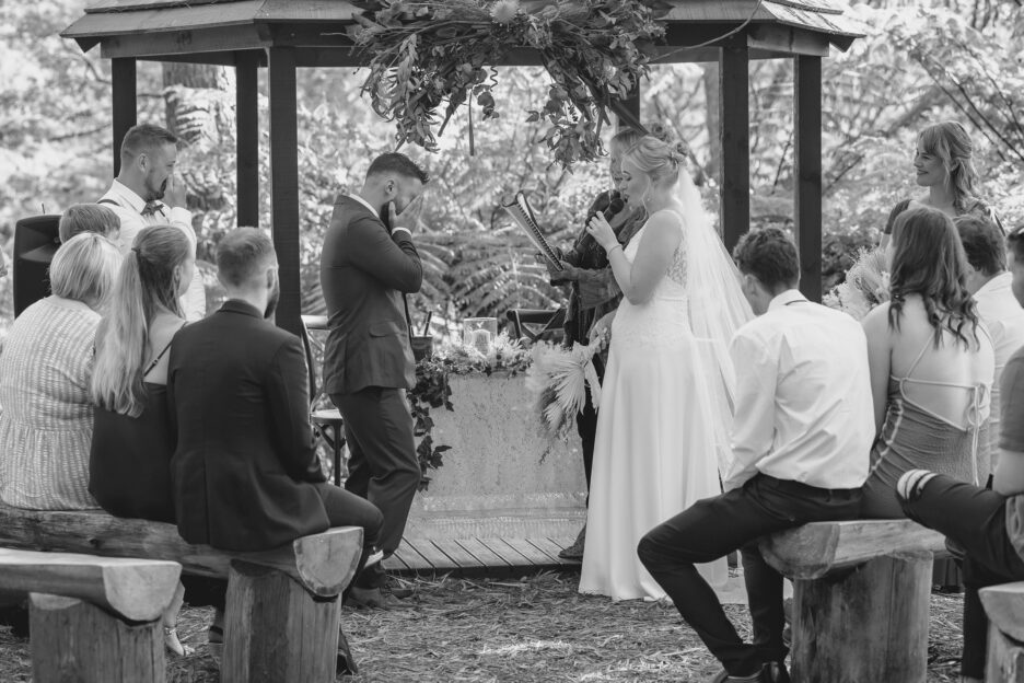 Groom crying as bride says vows