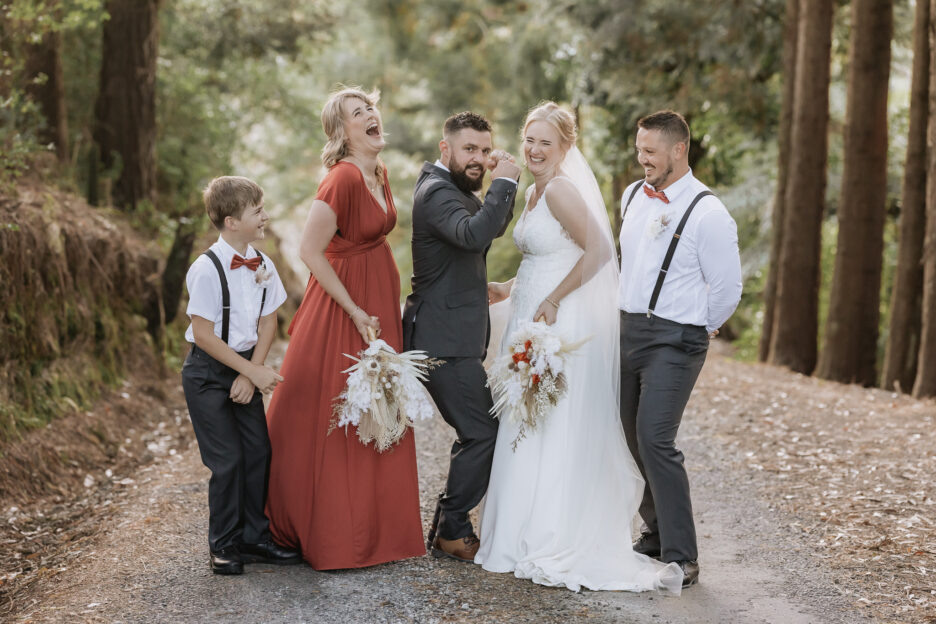 Wedding party dancing on driveway at Waihi Karangahake Gorge New Zealand