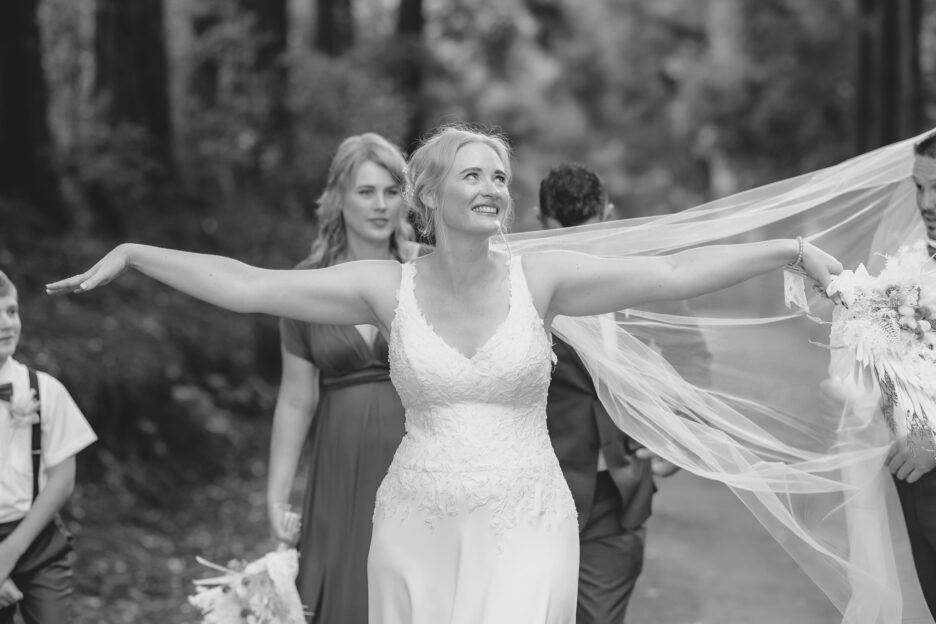 Bride laughing as veil is entangled