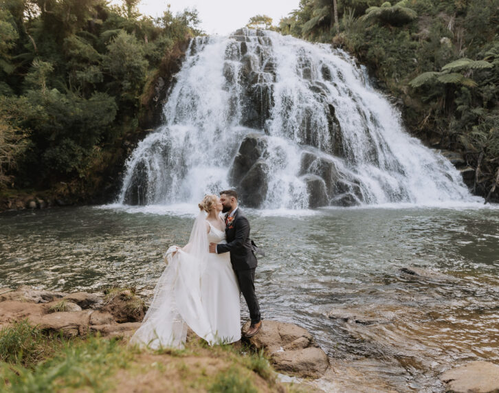 wedding photo in front of Owharoa Falls in Karangahake gorge Waihi