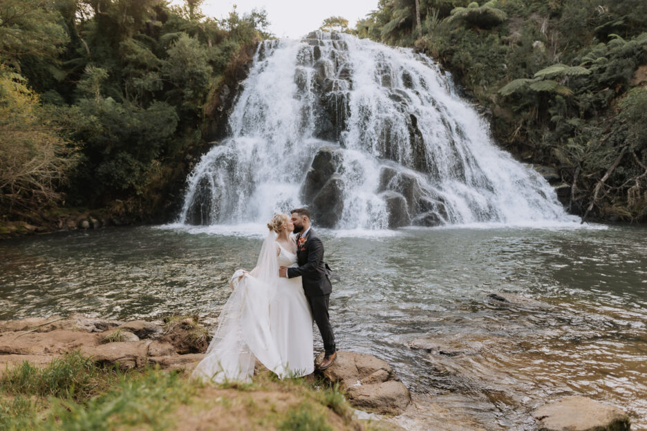 wedding photo in front of Owharoa Falls in Karangahake gorge Waihi