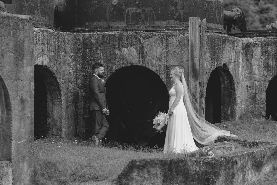 Wedding photo standing in front of Victoria battery Karangahake Gorge New Zealand