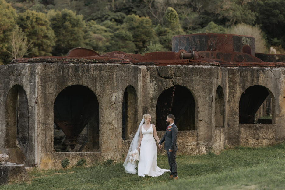 Bride and groom walking Victoria battery Waihi New Zealand