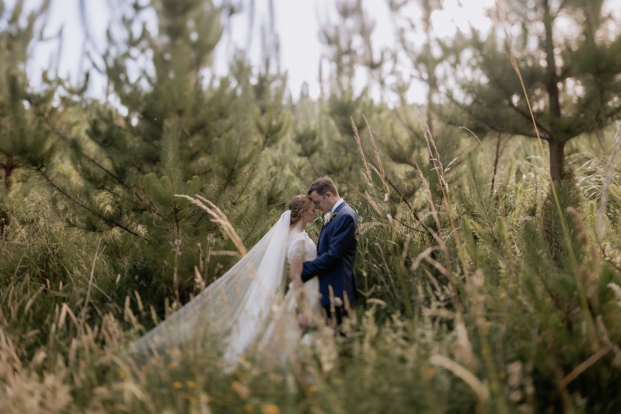 Vintage Wedding photo of couple in forest