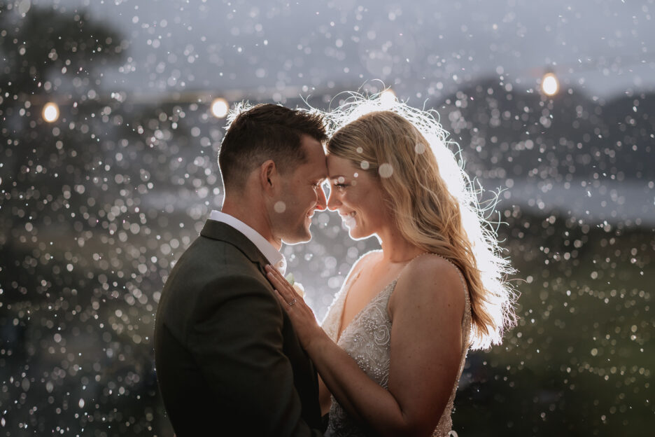 Wedding photos at dusk under rain drops