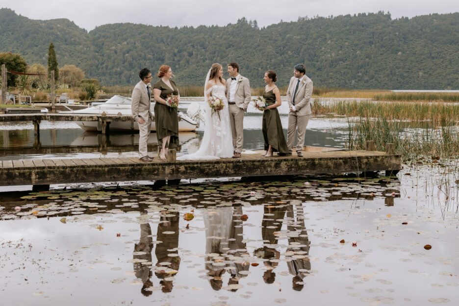 wedding party on wharf at lake Okareka at Longfords Estate