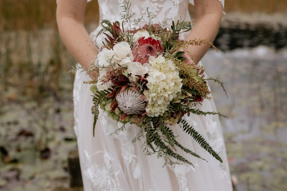 Bride holding country colors bouquet