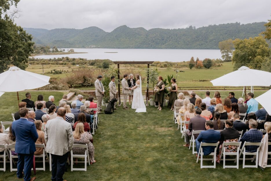 Wedding ceremony scene at Longfords estate in rotoura with lake okareka scenery