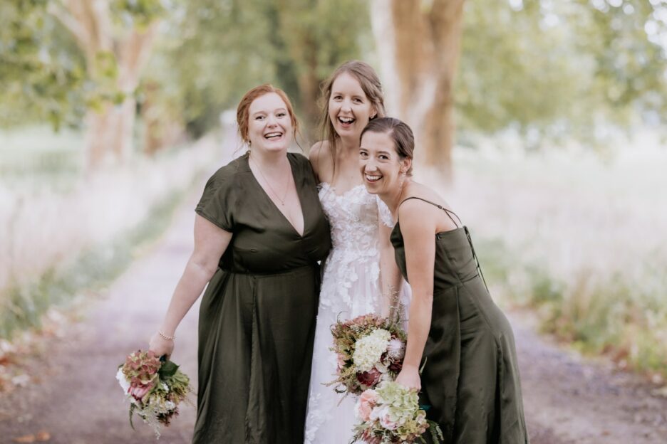 Bride and bridesmaids having fun giggling